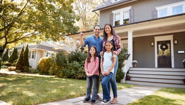 Family in front of house